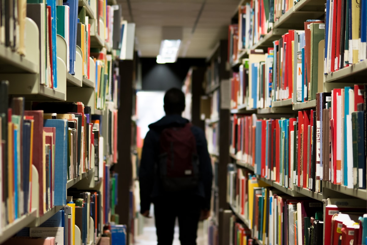 Student walking through a university library